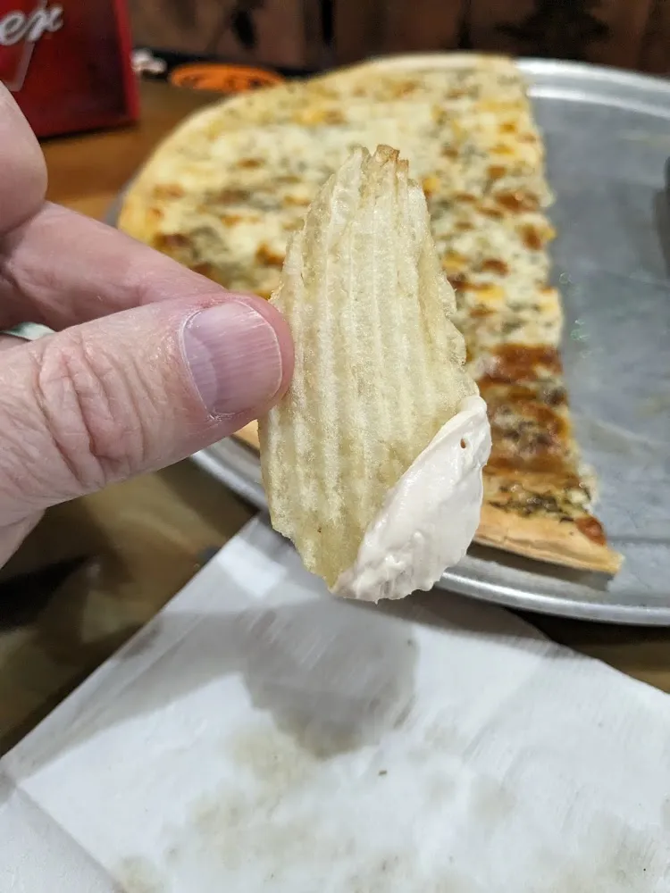 French Onion Dip with Ripple Chips and Pizza Fry in the Background